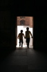 Two kids enter a dark room at the Agra Fort.